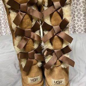BARELY WORN UGG tall brown boots with bows !